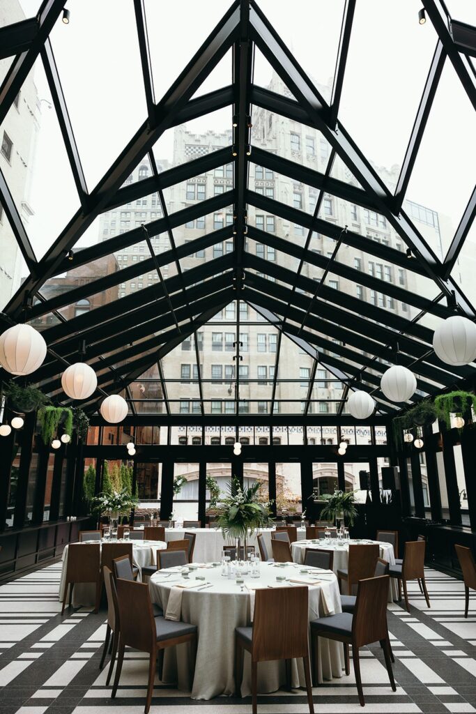 An indoor Shinola Hotel wedding reception in The dRoom