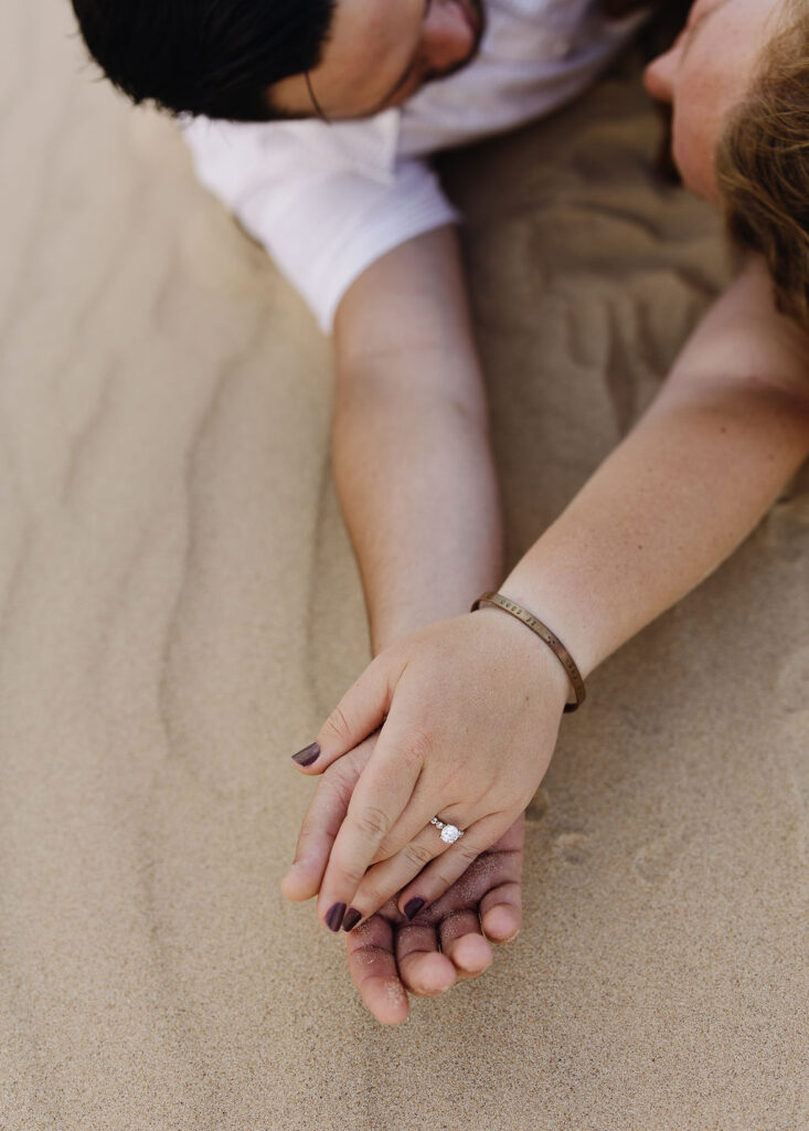 Couple laying on the beach together