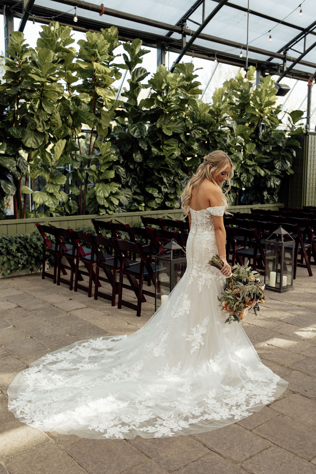 Bride posing at Planterra Conservatory wedding venue in Michigan