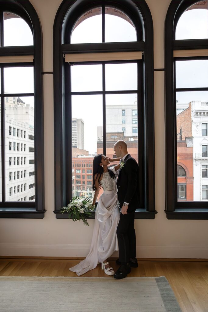 Bride and grooms indoor Shinola Hotel wedding portraits in Detroit, Michigan