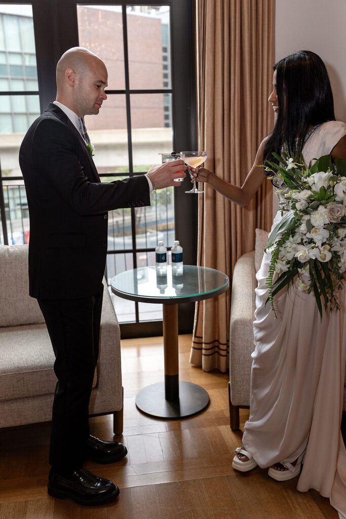 Bride and groom having drinks after their Shinola Hotel wedding ceremomny