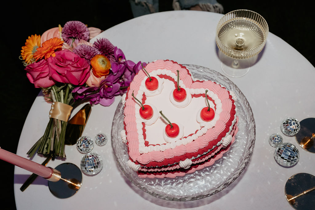 Wedding reception flash photo of a heart shaped wedding reception cake