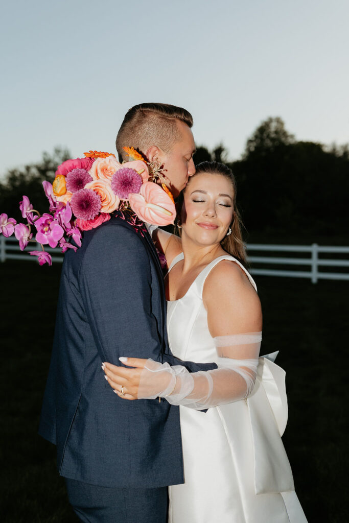 Bride and groom posing for their wedding reception flash photos