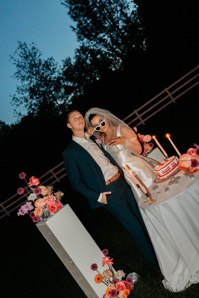 Bride and groom posing for their wedding reception flash photos