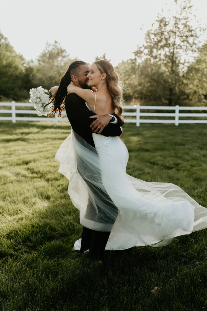bride and groom celebrate at golden hour at Venue 3Two